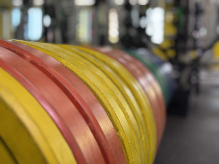 Close-up of stacked colour-coded Ziva bumper plates