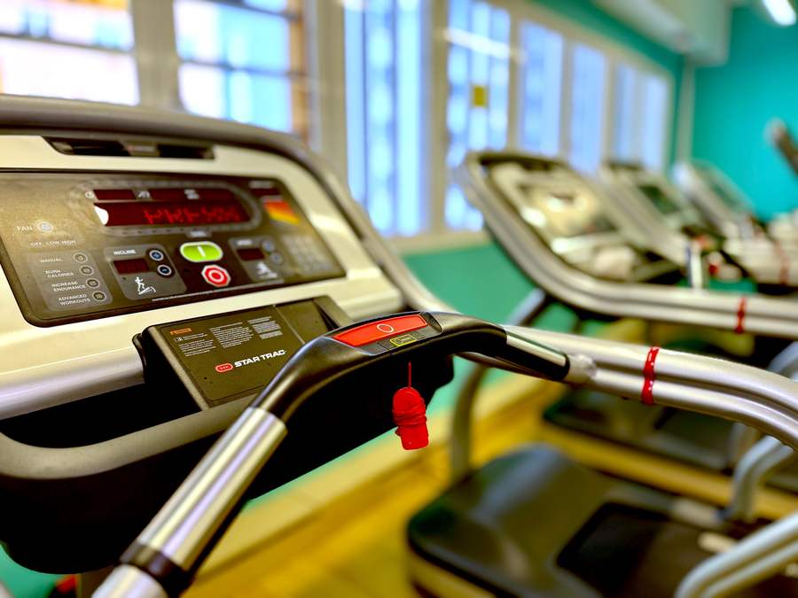 Close-up of a Star Trac treadmill console showing incline, speed and programme buttons