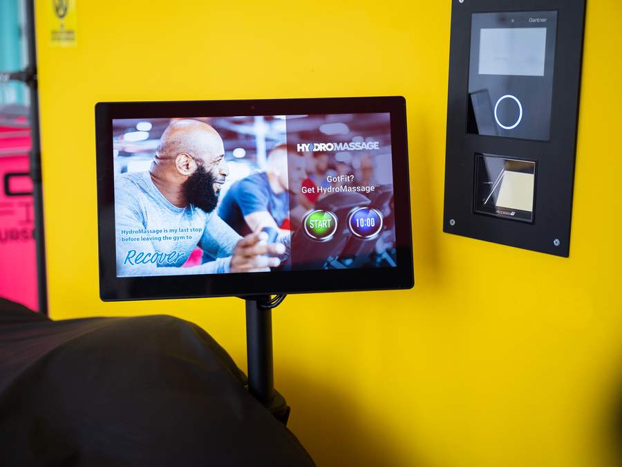 Close-up of the HydroMassage touchscreen showing the start button and a ten minute timer beside the access reader